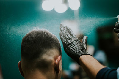 Rear view of man at salon