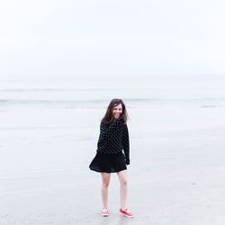 Woman standing on beach