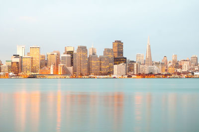 View of cityscape by bay of water