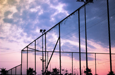 Low angle view of suspension bridge against sky