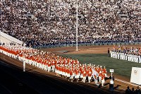 1964 Tokyo Olympics -- The Japanese delegation marches under blue skies during the opening ceremony on Oct. 10. It was first time for Japan to host a summer or winter games. Japan won 16 gold medals, tying the record for the country. A total of 93 nations and regions participated in the global event.