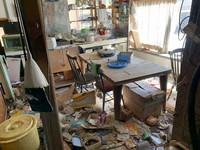 The inside of a house in the difficult-to-return zone is seen in the Fukushima Prefecture town of Namie. Many homes in the zone have been ravaged by wild animals. (Mainichi)