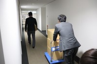 Agency for Cultural Affairs staff are seen taking materials to request an order to dissolve the former Unification Church in this photo provided by the agency.