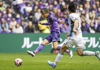 Sanfrecce Hiroshima's Mutsuki Kato scores against Consadole Sapporo during a J-League first-division football match at Edion Peace Wing Hiroshima on Dec. 1, 2024. (Kyodo)