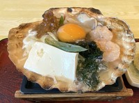 The Shimokita Peninsula's traditional "misokayaki," in which ingredients are cooked on a large scallop shell, is seen at the Nakagawa restaurant in Mutsu, Aomori Prefecture, on Sept. 19, 2024. (Mainichi/Tatsuma Kasama)