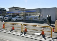 This photo taken Dec. 17, 2024, shows newly installed fences near a convenience store at a popular spot for photographing Mt. Fuji in Fujikawaguchiko, Yamanashi Prefecture. (Kyodo)