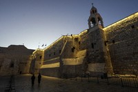 Nuns walk along the Church of the Nativity, traditionally believed to be the birthplace of Jesus, on Christmas Eve, in the West Bank city of Bethlehem, on Dec. 24, 2024. (AP Photo/Matias Delacroix)