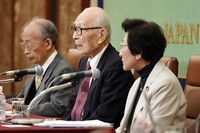 From left, Jiro Hamasumi, Terumi Tanaka and Michiko Kodama, representatives of this year's Nobel Peace Prize winner Nihon Hidankyo, or the Japan Confederation of A- and H-Bomb Sufferers Organizations, attend a press conference at Japan National Press Club on Dec. 24, 2024, in Tokyo. (AP Photo/Eugene Hoshiko)