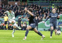 Celtic midfielder Reo Hatate, left, scores during a Scottish Premiership football match against Motherwell at Celtic Park in Glasgow, Scotland, on Dec. 26, 2024. (Kyodo)