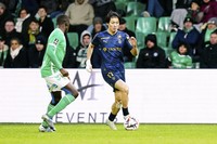 Reims' Keito Nakamura, right, dribbles against Saint-Etienne during a French Ligue 1 match at Stade Geoffroy-Guichard in Saint-Etienne on Jan. 4, 2024. (Icon Sport/Getty/Kyodo)