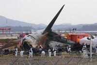 Rescue team members work at the site of a plane crash at Muan International Airport in Muan, South Korea on Dec. 31, 2024. (AP Photo/Ahn Young-joon, File)