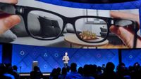 Mark Zuckerberg presenting an AR smart glasses concept on stage at Facebook F8 software conference