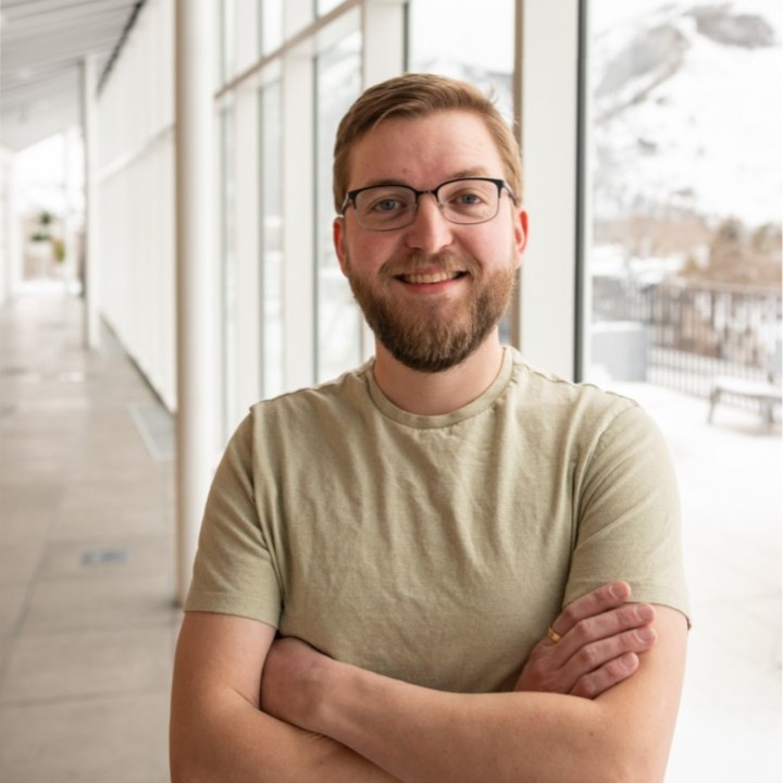 A headshot of Scott Mathson from Amplitude