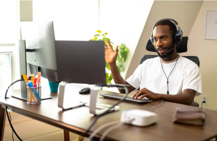 Tucows employee waving hello during a video call