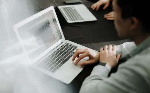 Automation - A picture of a person working on their laptop