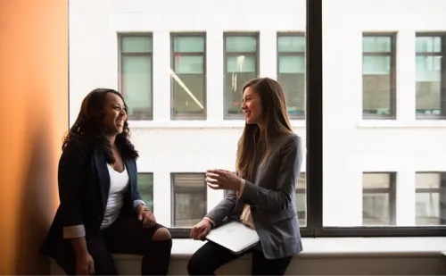 User Adoption - A picture of two team members talking together