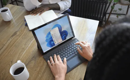 A picture of an engineer on their laptop