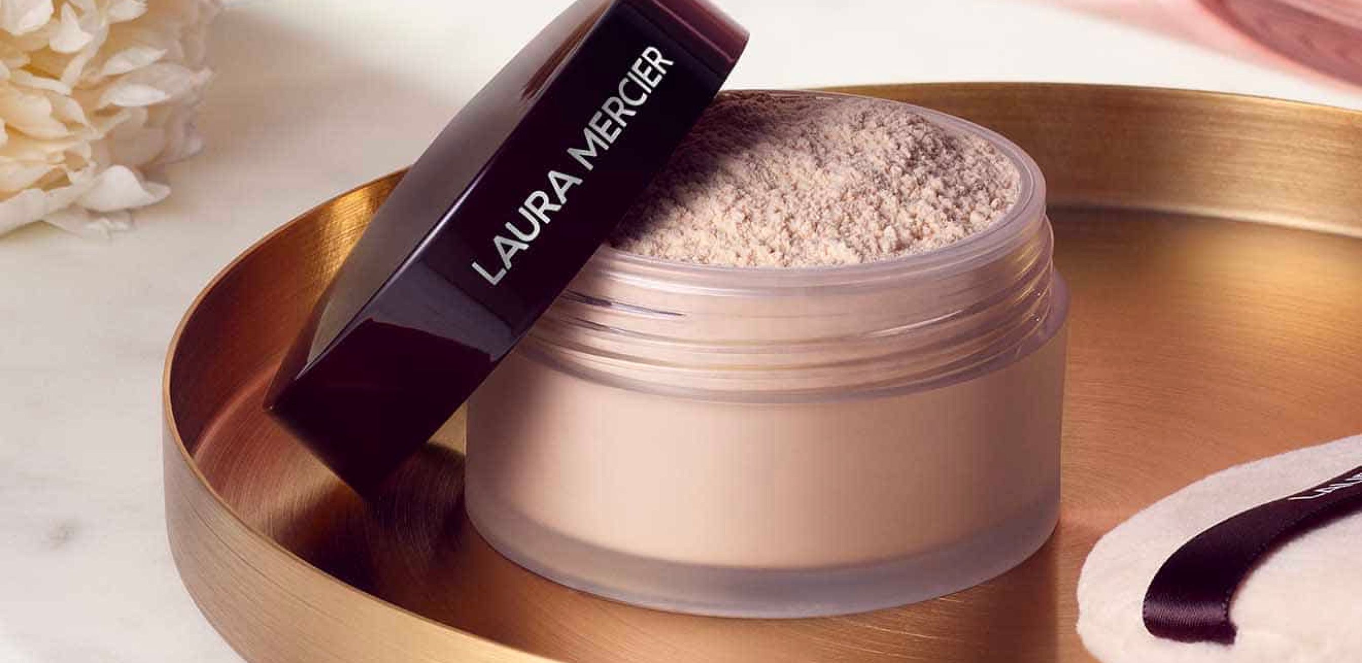 Decorative editorial element for Laura Mercier