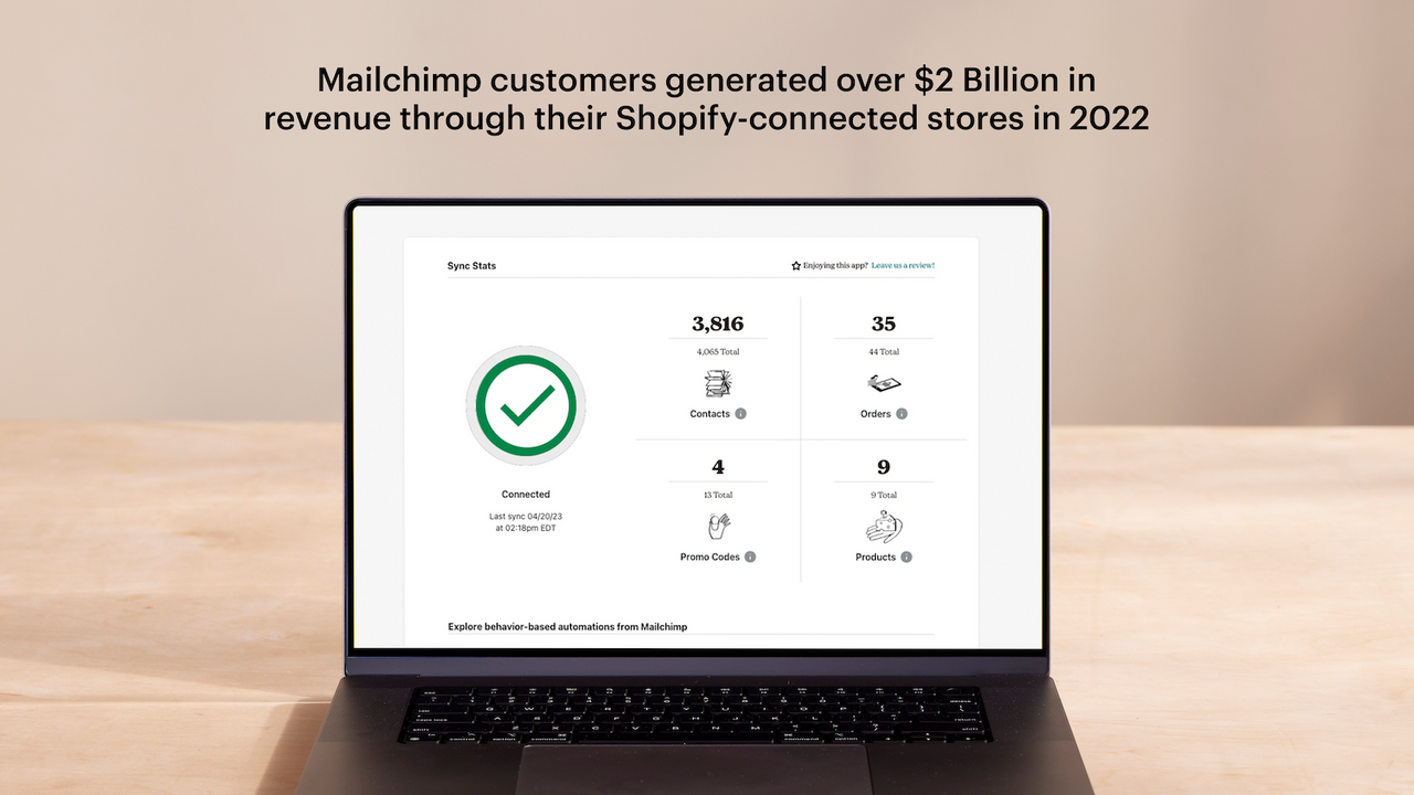 Laptop displaying dashboard with synced stats and customer data