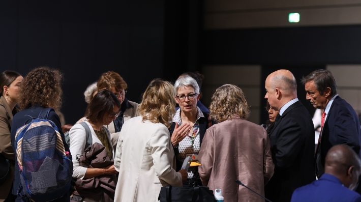 People in a discussion at a conference