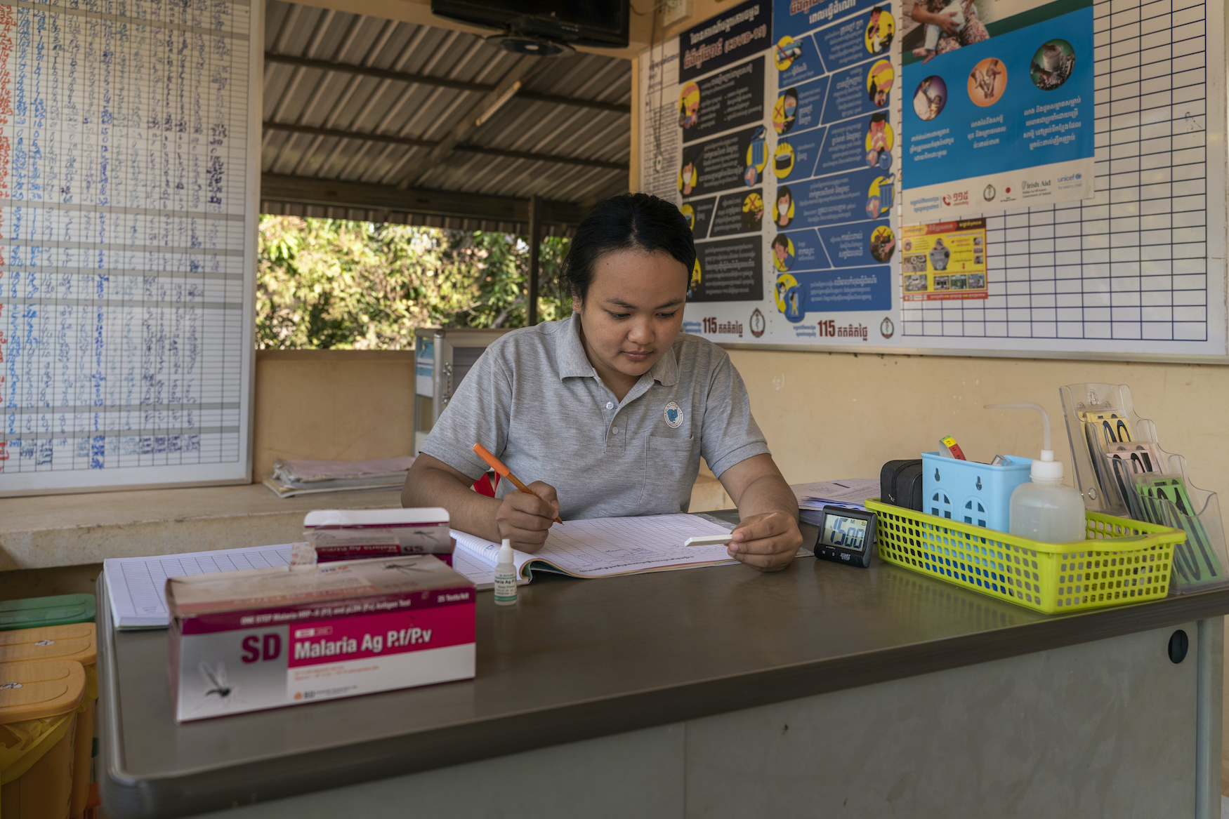 Cambodia: Portrait of Ly Kanha, midwife and health centre malaria worker