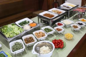 a buffet with many dishes of food on a table at Country Hotel Takayama in Takayama