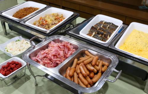 a buffet with many trays of different types of food at Country Hotel Takayama in Takayama