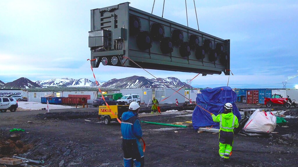 The first collector being lifted by a crane