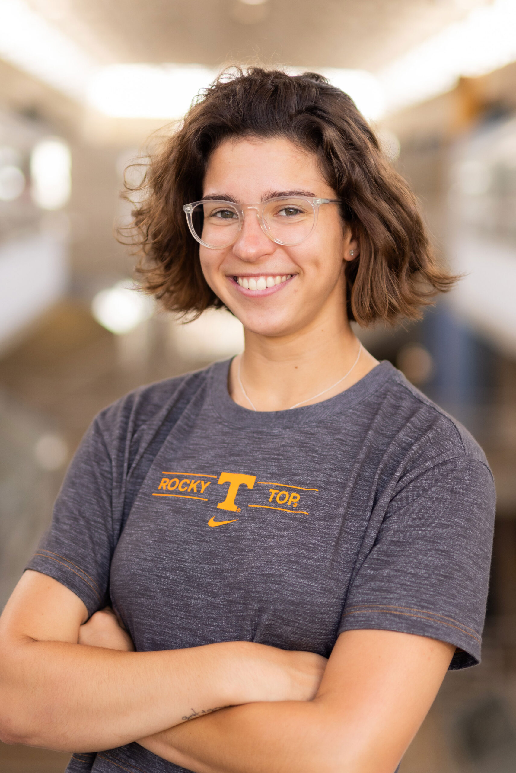 Margaret Marando stands in the center of the Art and Architecture building on campus