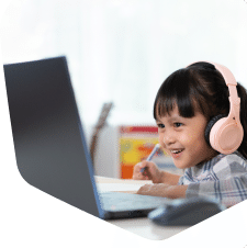 Two young children together looking on their tablet