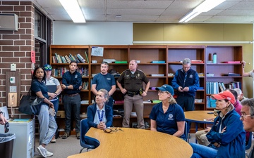 Federal and State Officials Receive a Briefing on Greenfield Damage