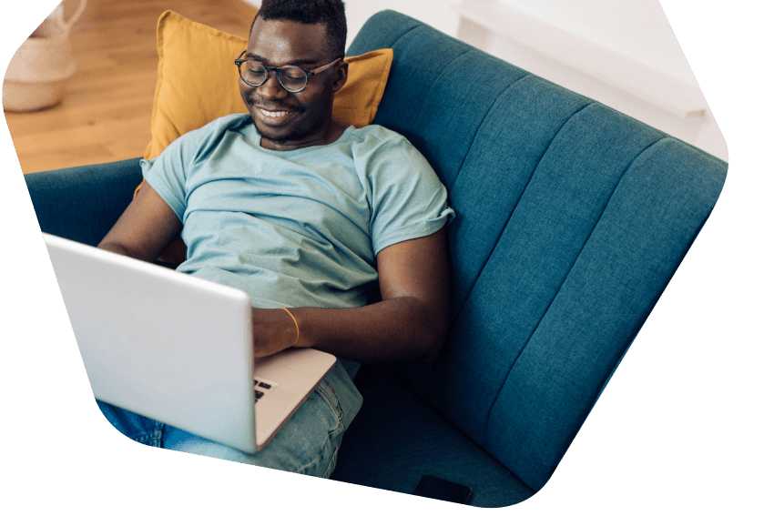 Happy family sitting together all using devices at home