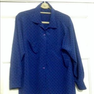 Black polka dots on royal blue shirt.