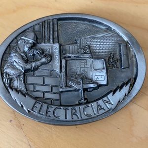 Men’s vintage (1988) decorative belt buckle highlighting an electrician.