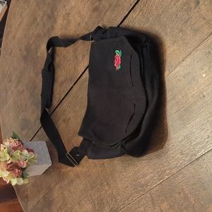 Black messenger bag with rose