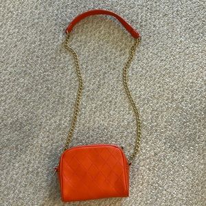 Faux leather orange crossbody or shoulder purse with gold chain strap