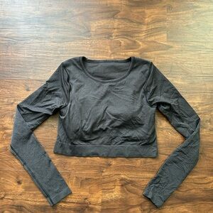 Lululemon Ebb To Street Long Sleeve 
Charcoal Black 
Size 10 
Built In Bra Pads