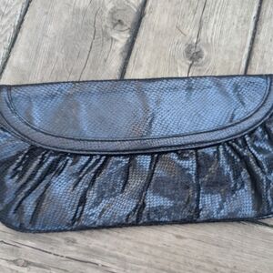 Vintage  black faux snake skin clutch with purple interior