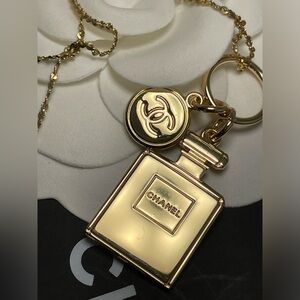 14 karat gold necklace with Chanel Goldtone perfume charms