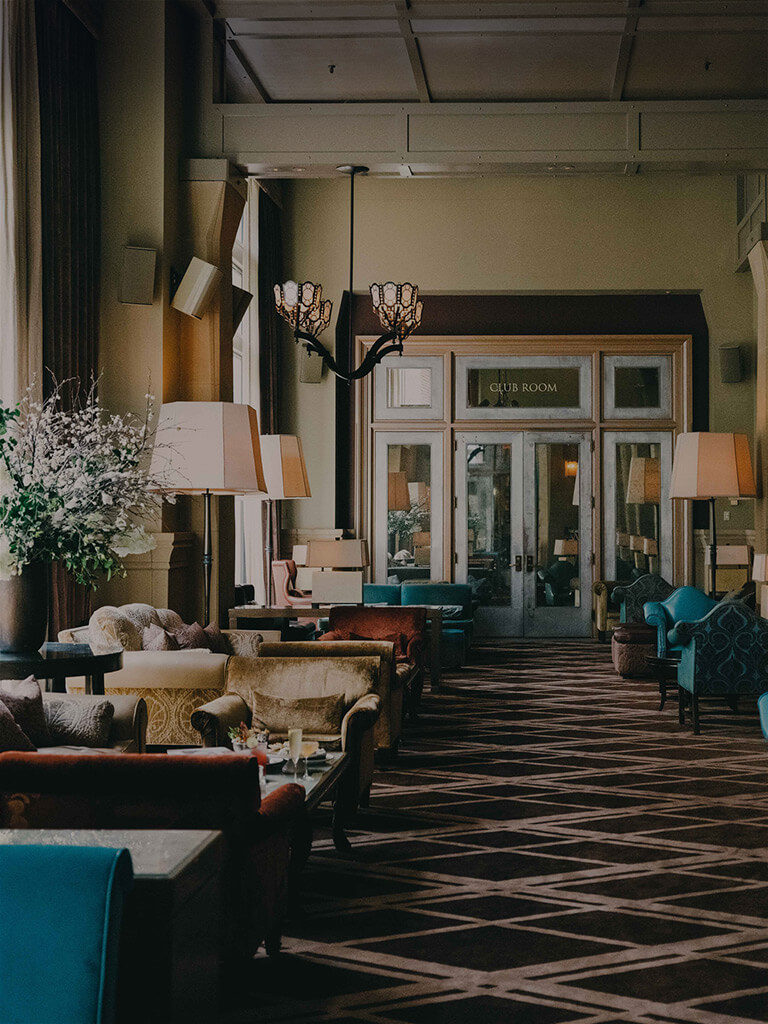 Interior shot of the Salon at the Soho Grand. There are multiple couch set ups for social gatherings