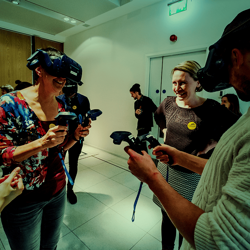 people experimenting with virtual reality headsets