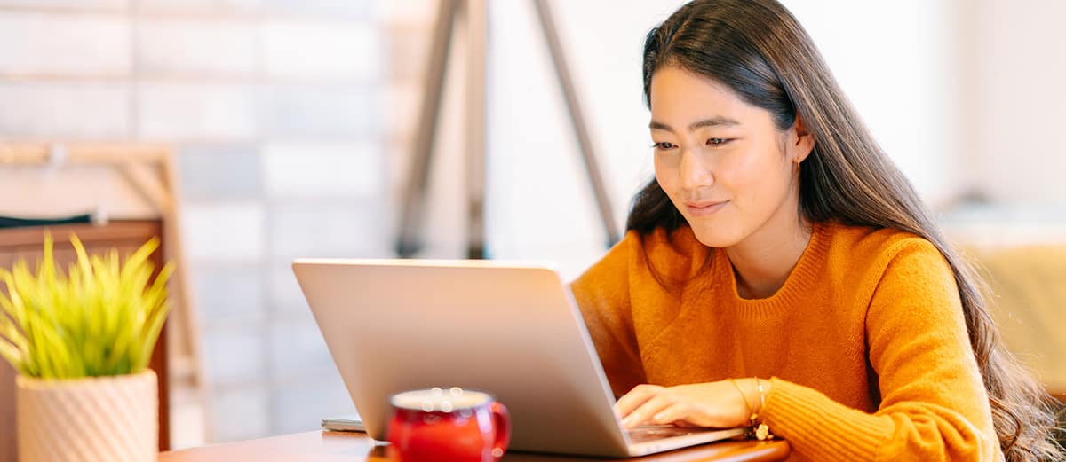 a female student at a laptop