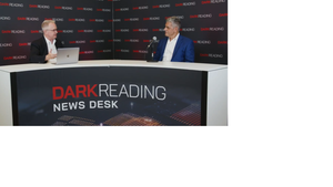 Two people talking at a news desk against a dark backdrop with "Dark Reading" written on it.