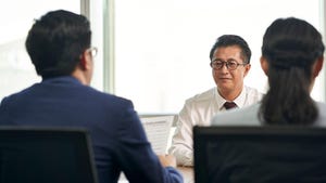 mature job seeker asian business man being interviewed by young human resources executives