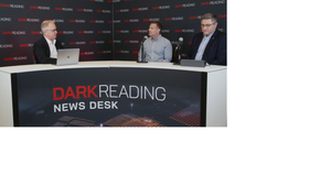 Two people talking at a news desk against a dark backdrop with "Dark Reading" written on it.