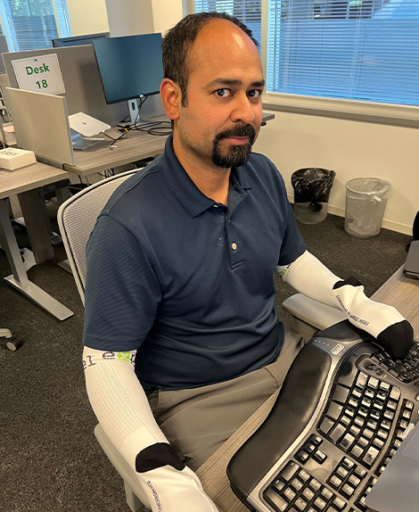 Yanek Korff (Chief of Staff) working socks on hands