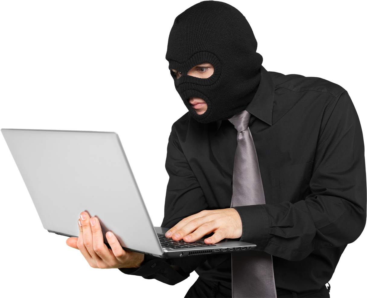 A Man Wearing A Black Mask And Tie Holding A Laptop