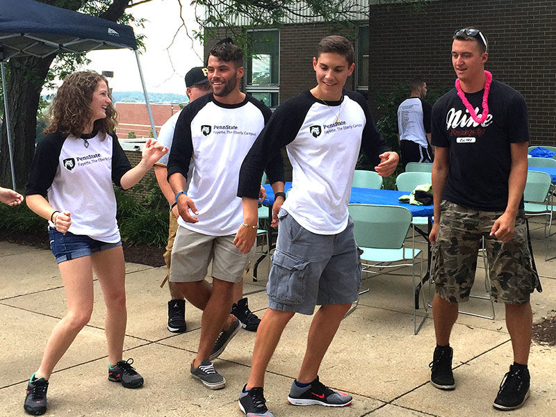 Students dancing on campus.