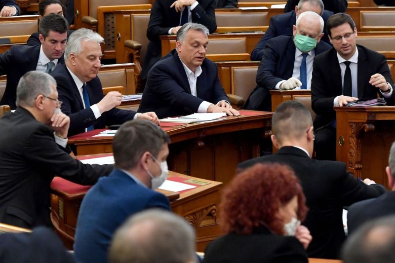 Hungarian Prime Minister Viktor Orban (center) votes with other representatives in the Hungarian parliament in Budapest on March 30.