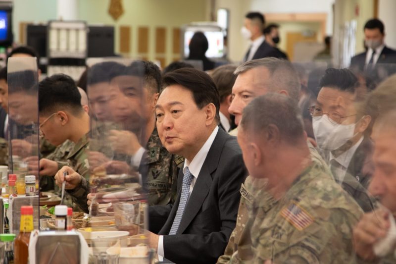 South Korean President-elect Yoon Suk-yeol dines with Maj. Gen. David Lesperance, commander of the U.S. 2nd Infantry Division, and other soldiers at Camp Humphreys in Pyeongtaek, South Korea, on April 7.